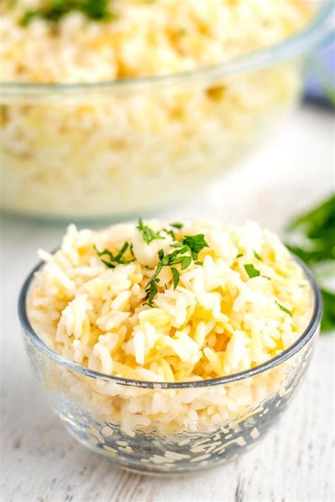 Two Bowls Filled With Rice And Garnished With Parsley