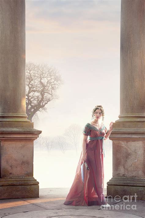 Regency Woman Standing Between Two Stone Pillars In Winter Photograph