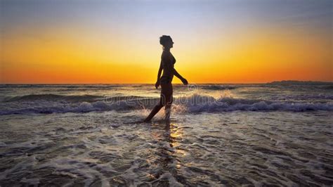 Cinematic Shot Of Woman Walking On Water Stock Photo Image Of Runner