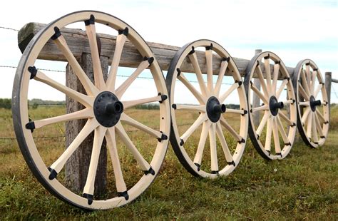 Display Of Rebuilt Cannon Wheels Along Fence Wood Wagon Wooden Wagon