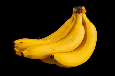 Bunch Of Yellow Ripe Bananas Isolated On A Black Background Stock Photo