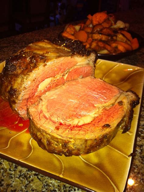 Prime rib — tender, succulent, juicy and easy to. Roasted prime rib with roasted winter vegetables (carrots, butternut squash, beets, garli ...