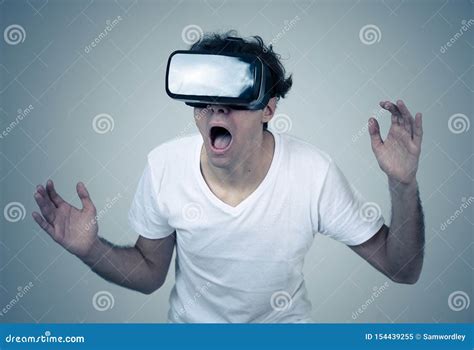 Young Man Having A Scary Experience With Virtual Reality Goggles