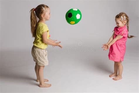 Ccheerful Kids Throwing And Catching Ball Concept Of Happiness And
