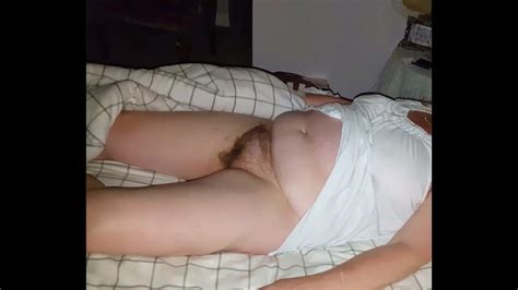 Wife Laying On The Bed With Her Hairy Pussy Exposed