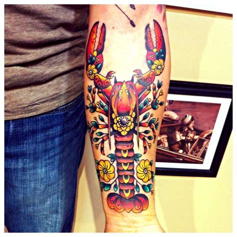 A Man With A Colorful Lobster Tattoo On His Arm And Leg Is Standing