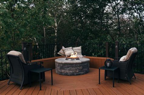 Most composite decks will melt and your fire pit will be tossed out without some kind of protection. Composite Deck with Built-in Stone Fire Pit | Archadeck of ...