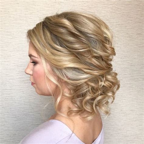 Updo hairstyles are perfect for formal occasions, like a wedding or a prom, which require a hairstyle that is elegant, works with your dress and accessories, and suits your personal attributes perfectly. Untamed Tresses | Naturally curly wedding hairstyles