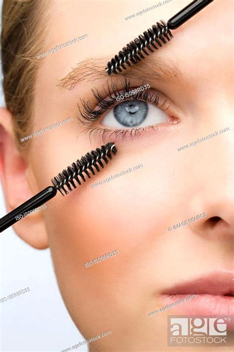 Woman With Two Mascara Brushes Stock Photo Picture And Royalty Free