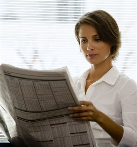 Young Woman Reading Newspaper Energise Legal