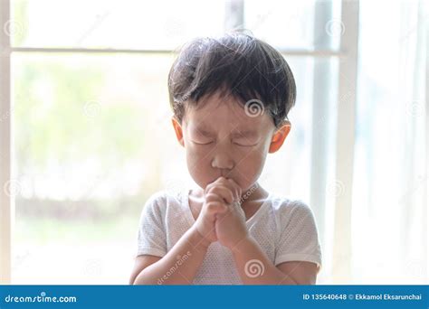 A Little Prayer A Boy Is Praying Seriously And Hopefully To Jesus