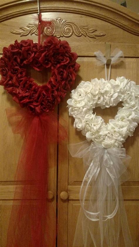 Two Wreaths Are Hanging On The Wall Next To Each Other One Is Red And