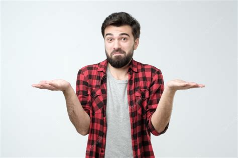 Premium Photo Confused Hispanic Man Giving I Dont Know Gesture On