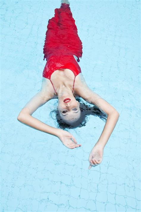 Woman In A Red Dress Swimming In The Pool Stock Image Image Of