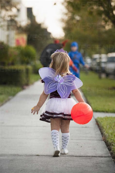 Children Going Trick Or Treating Stock Photo