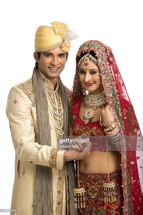 Smiling Indian Newlywed Couple In Traditional Wedding Dress Photo