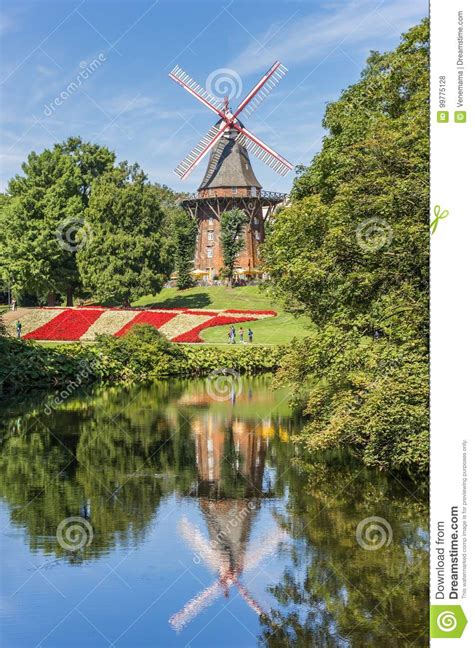 Historical Windmill With Reflection In The Water In Bremen