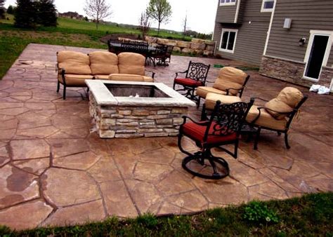 Colored And Stamped Concrete Patio With Stone Fire Pit Yelp