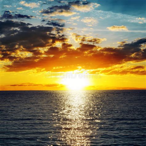 Orange Sunset Over Water Stock Image Image 35692251