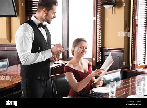 Waiter Taking Order In Restaurant Stock Photo Alamy