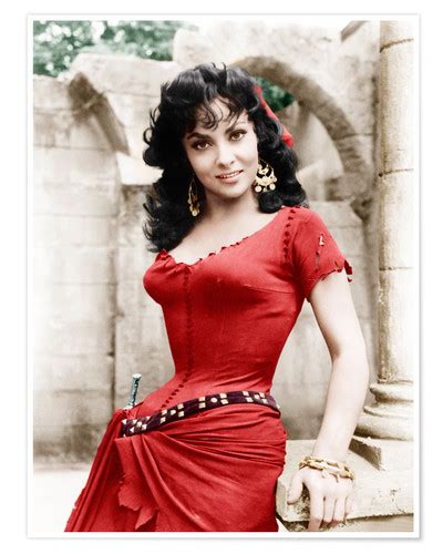 The italian icon dressed up for the occasion by wearing a dramatic blue dress with gold print and lining. Gina Lollobrigida | Posterlounge.it