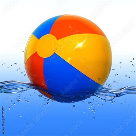 Colorful Beach Ball Floating In Water Stock Photo And Royalty Free