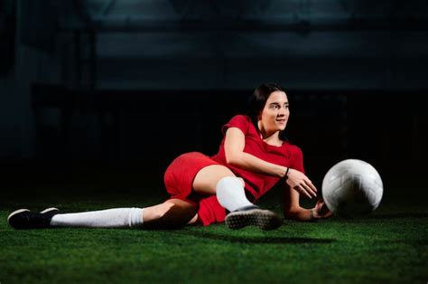 Free Photo Female Football Player Kicking Ball