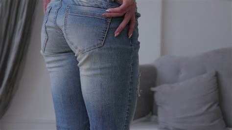 Girl Slowly Takes Off Jeans Stock Footage Videohive