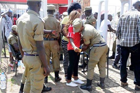 Photos Of Ugandan Police Fondling Women In The Name Of Security