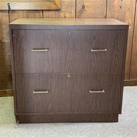 Bisley directs range of two drawer filing cabinets. FAUX WOOD TWO-DRAWER FILING CABINET
