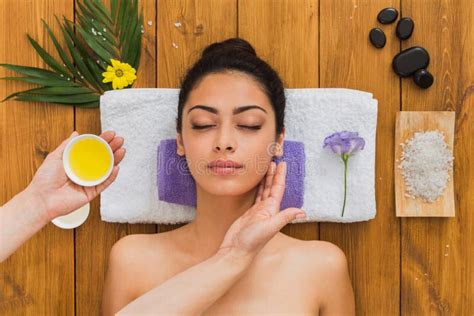 Woman Massagist Make Face Lifting Massage In Spa Wellness Center Stock