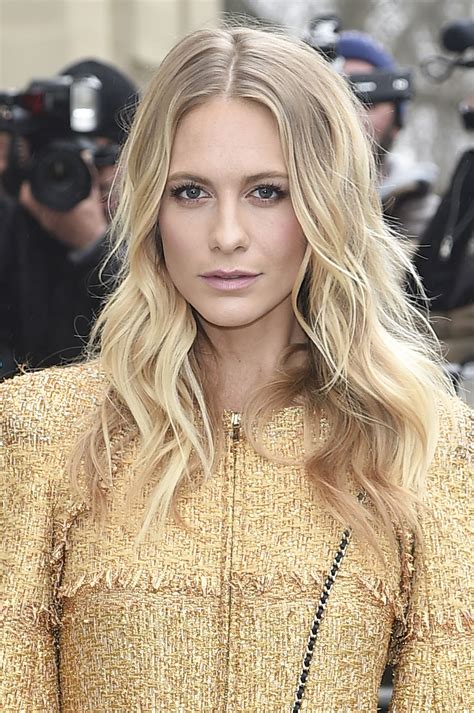 poppy delevingne shows off her long layered haircut at paris fashion week glamour
