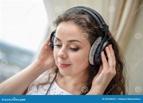 Young Woman Listening To The Music On Headphones Stock Photo Image Of