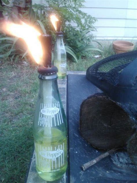 Repurposed glass soda bottles into tiki torch. | Soda bottles, Urban garden, Bottles and jars