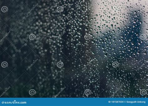 Blurred And Focus Of Rain Drop On Glass Window In Monsoon Season Stock