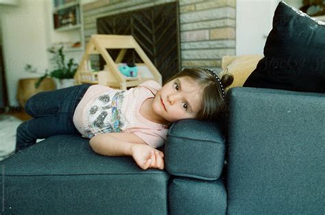 Little Girl Relaxing On Couch By Stocksy Contributor Maria Manco