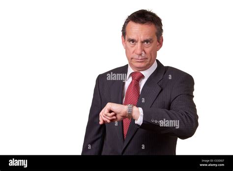 Frowning Angry Middle Age Business Man In Suit Looking At Time On Watch