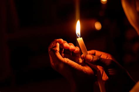 Person Holding Lighted Candle · Free Stock Photo