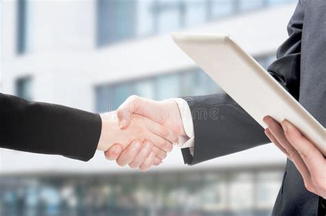 Two Business People Shaking Hands Stock Image Image Of Businessmen