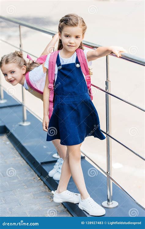 Schoolgirls With Pink Backpacks Playing Stock Image Image Of Friends