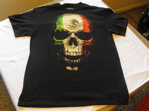 In the centre of the middle band, the flag bears the eagle of saladin, the national symbol of egypt since 1952. L Black MEXICAN SKULL green, white and red, eagle, flag ...