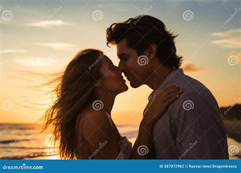 Against The Backdrop Of A Breathtaking Sunset A Deeply In Love Couple Shares An Intimate And