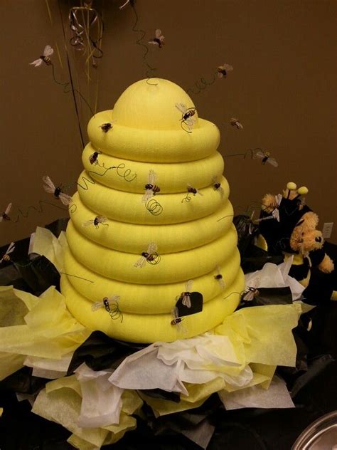 Roses, carnations, hydrangeas, peonies, greenery, orhids, lilies Bee hive for baby shower...Pool noodles wrapped in yellow ...