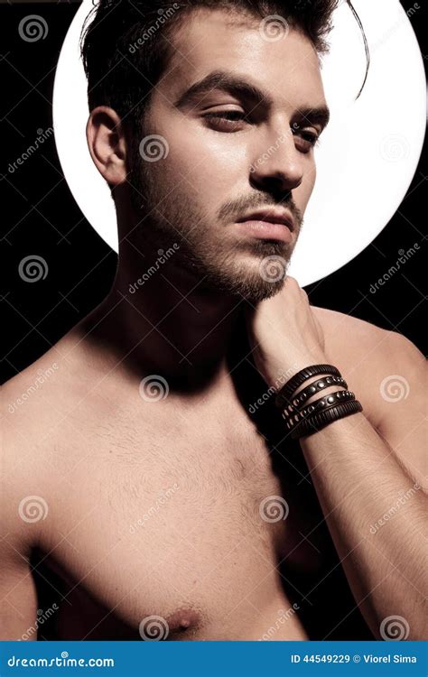 naked man with light aura holding hand on neck stock image image of hairstyle caucasian 44549229