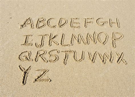 Alphabet Letters Handwritten In Sand On Beach Stock Photo Spon