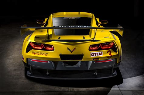 Interior features include a jet black leather trimmed and suede wrapped interior, competition sport seats, suede wrapped steering wheel and shifter, yellow contrast. 2014 Chevrolet Corvette C7.R | GM Authority