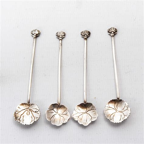 An Early Set Of Four Liberty Silver Japanese Salts And Spoons The