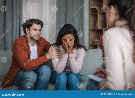 Sad Millennial European Man Comforting Crying African American Woman On