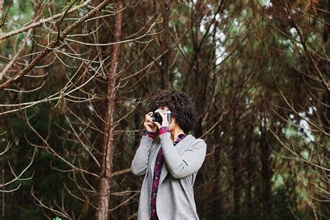 Girl Taking A Photo In A Forest By Stocksy Contributor Ellie Baygulov Stocksy