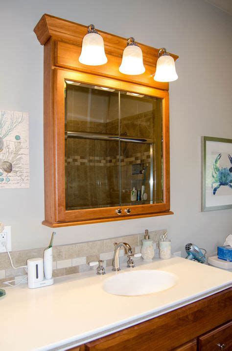 Individual Medicine Cabinet With Overhead Lights On A Double Vanity